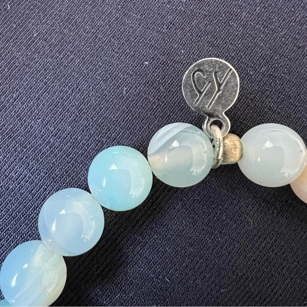 T Jazelle blue aquamarine bracelet with wave charm